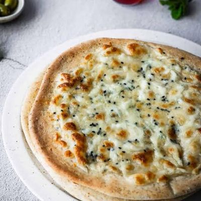 Flatbread with melted white cheese on top
