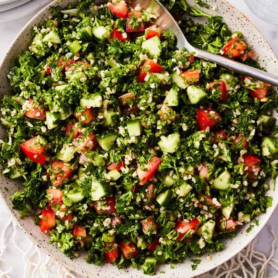 Tabbouleh salad with finely chopped parsley, bulgur, tomato and cucumber, served in a bowl